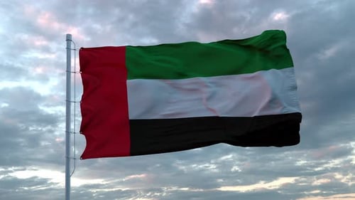 Realistic Flag of United Arab Emirates Waving in the Wind Against Deep Dramatic Sky. UHD 60 FPS Slow