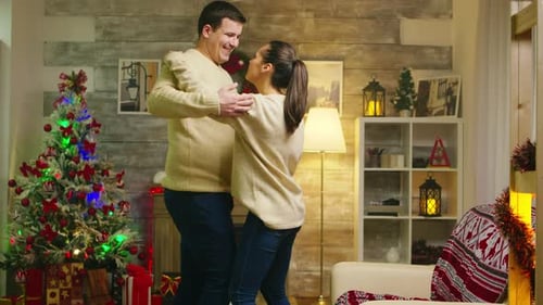 Happy Young Woman Dancing with Her Husband