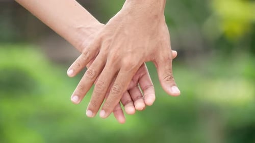 Intimate Couple Holding Hands in Natural Setting