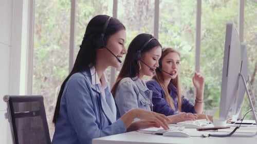 Customer Support Agent or Call Center with Headset Talking to Customer on Phone