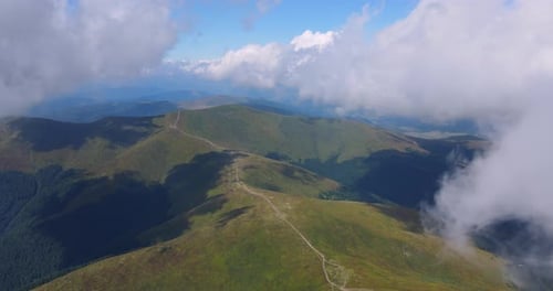 Aerial View of Green Mountain Ridges and Winding Road