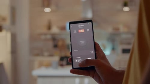 Man Turns On Kitchen Lights With Smart Home App