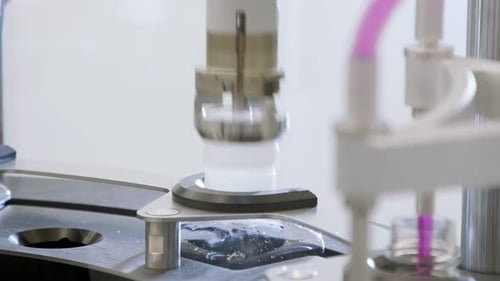 Automated Machines Filling Containers at a Laboratory