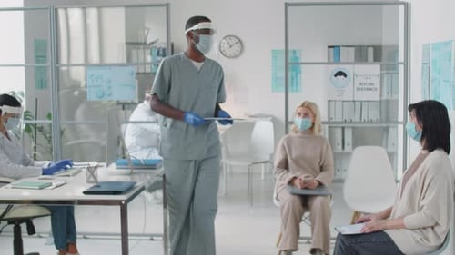 People in Waiting Room Wearing Face Masks