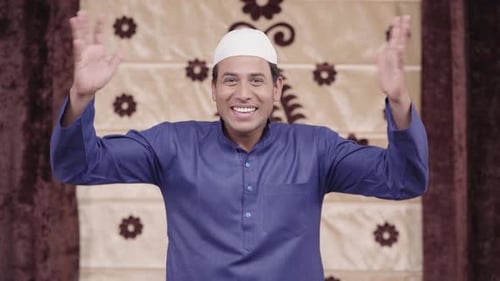 Cheerful Man Waving During Religious Holiday Celebration