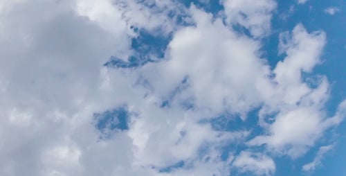 Clouds Rolling Across a Bright Blue Sky
