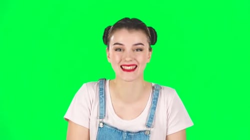 Girl Cute Laughing Against Green Screen at Studio. Slow Motion