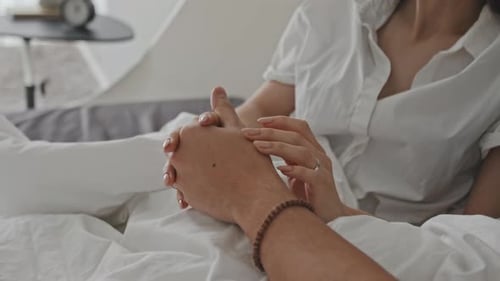 Close-Up Of Couple Holding Hands