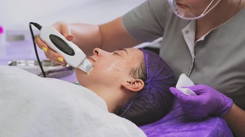 Woman Receiving Skincare Facial Treatment