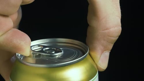 Close Up of Opening Foaming Drink Can