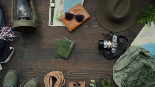 Top View of Various Travel Accessories on Table