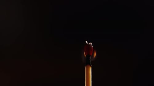 Burning Match Head Ignites Another in Macro Shot