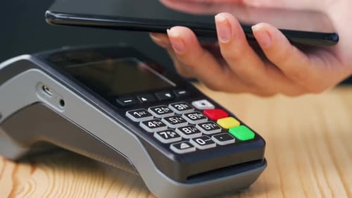Contactless Payment with Smartphone. Wireless Payment Concept. Close-up, Woman Using Smartphone