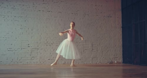 Elegant Ballerina Dancing Gracefully in a Light Studio