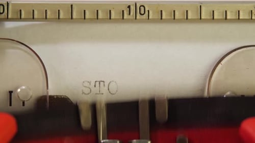 Red Typescript STOP COVID on Stationary Mechanical Typewriter