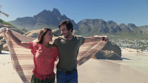 Couple running on beach