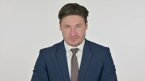 Man in Suit Poses Against White Background