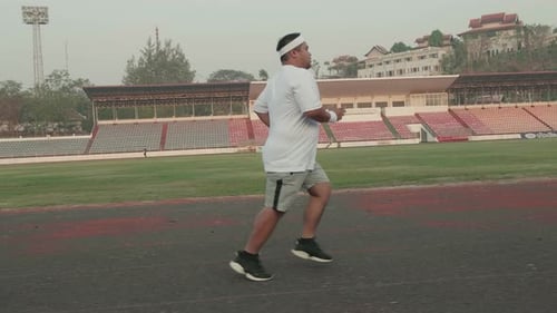 Fat Man Running For Exercising