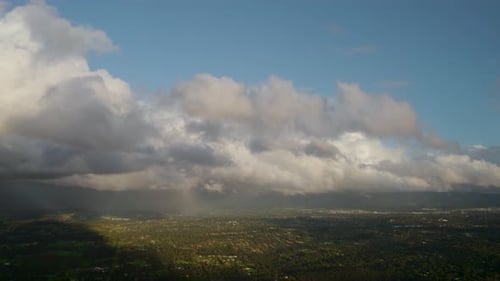 Aerial View of City Landscape with Clouds