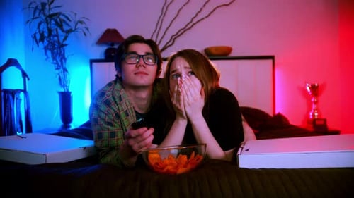Couple Watching Scary Movie at Home