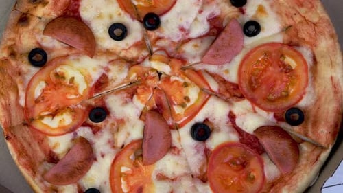 Overhead Shot of a Pizza with Tomatoes