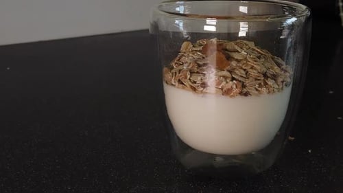 Healthy Yogurt Granola and Raisins in Glass