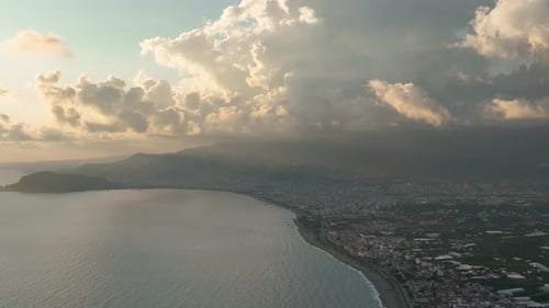 Beautiful cloudy sunset over the sea aerial view 4K