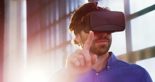 Young Adult Man Using VR Headset in Office