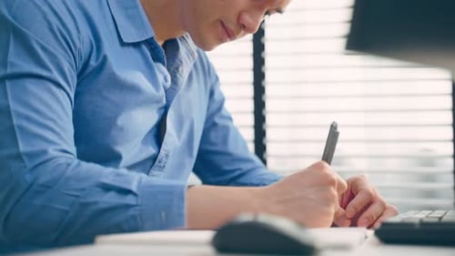 Asian handsome business man using laptop computer working in office.
