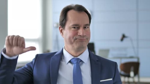 Thumbs Down By Businessman