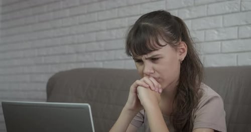 Upset Teen By Notebook