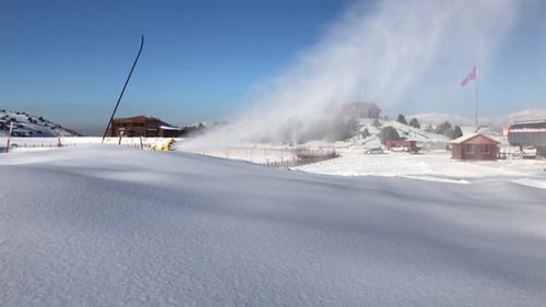 Snowy Mountain Landscape With Snow-Making Machines