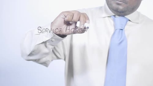 Asian Businessman Writes Service Agreement
