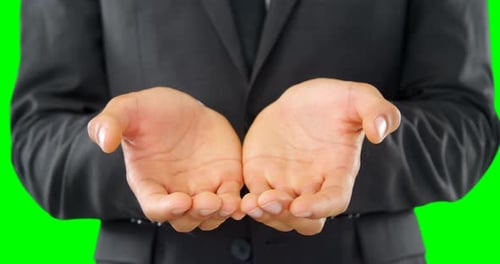 Man Presents Open Hands on Green Screen