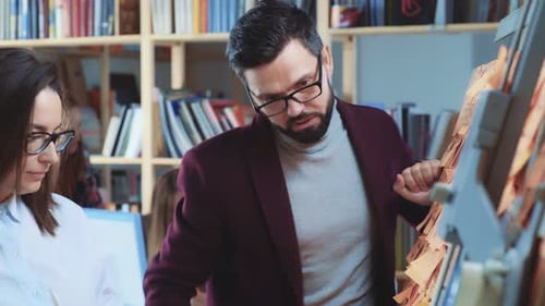 Colleagues Brainstorming with Sticky Notes in Office