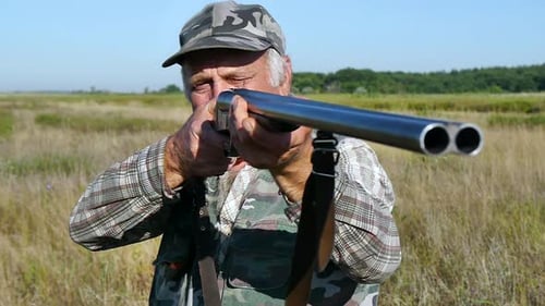 Hunter Aims with a Gun