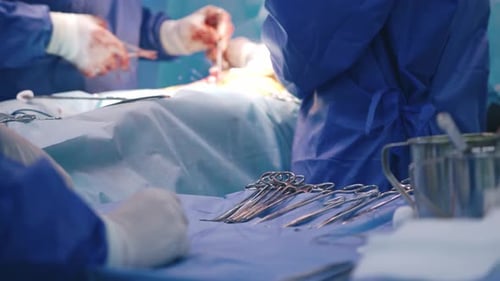 Surgeons Performing Operation in Operating Room