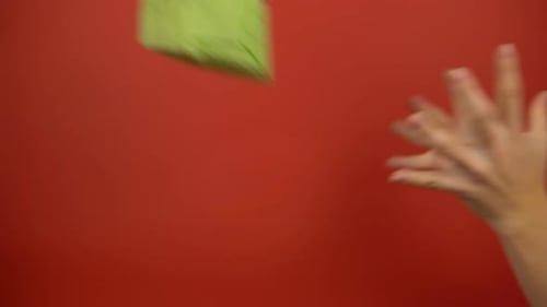 Hands Giving Colorful Birthday Presents on Red Background