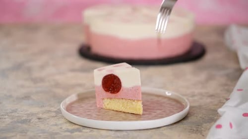 Fork Cuts into a Pretty Layered Cake Slice