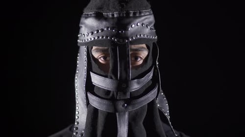 Hooded Figure Wearing Medieval Black Studded Helmet
