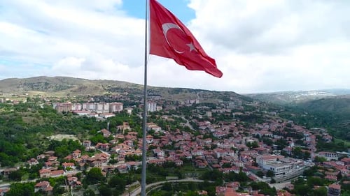 Cityscape Aerial with Waving Flag