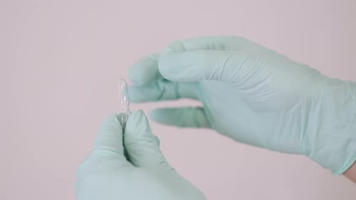 Doctor Holds COVID 19 Coronavirus Vaccine in His Hand
