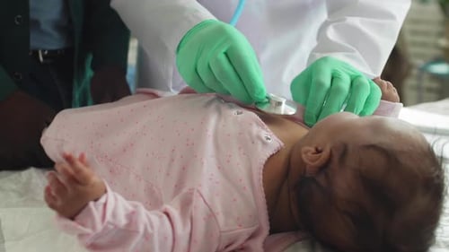 Doctor Examines Sweet Infant with Stethoscope