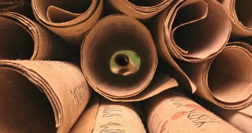 Medieval manuscripts library. Scrolls stacked on a pile.