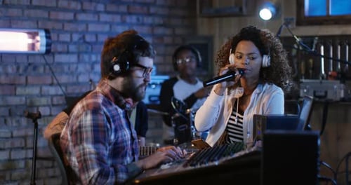 Young Musicians Playing in Home Studio