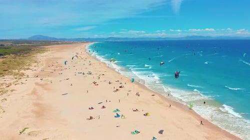Aerial View of Kitesurfing Extreme Sport with the Wind Freestyle. Beautiful Top View of Nice Beach