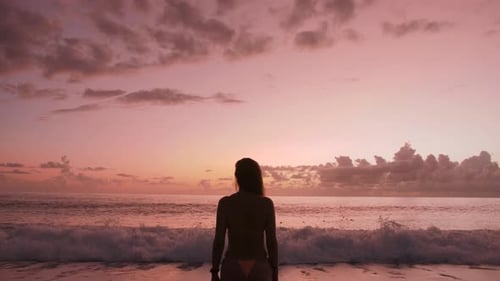 Woman Enjoying Ocean View During Golden Hour