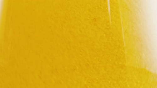Schaumiges Bier im Glas Nahaufnahme Textur