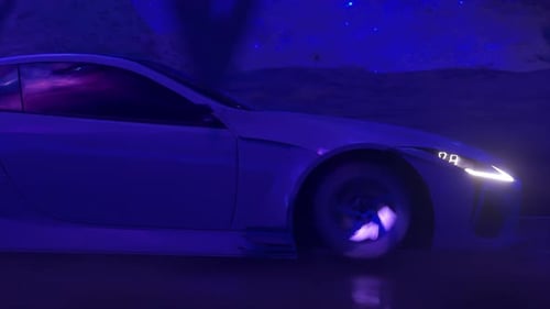 The Car Rushes at Fast Speed Along the Asphalt Road Along the Desert Into a Fabulous Sunset with a