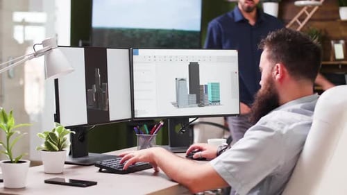 In Creative Media House Two Professional Architects Are Using 3D Software